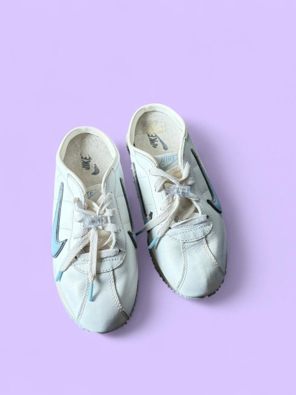 2004 vintage Nike Cortez mule slip-on sneakers featuring a white leather upper